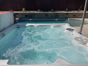 Amazing 9 person Hot Tub overlooking our pool with roman style fountains