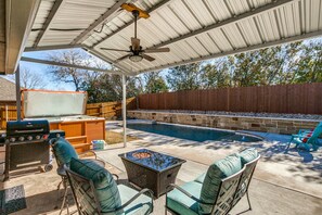 Awesome covered porch, firepit, grill, hot tub and spa. 43” outdoor TV mounted  