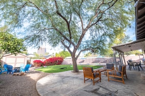 Relax in the large backyard while the kids run around playing games. 