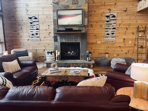 Cozy living room with lots of seating around the fire or to watch the frame TV!