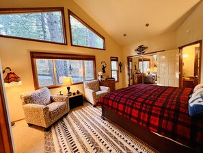 Master bedroom (king bed) features massive windows overlooking the nature.