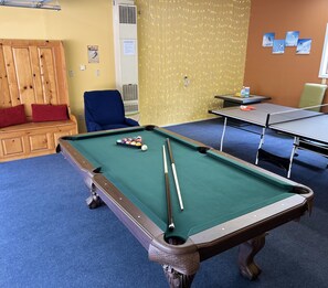 All new beautiful game room with large pool table and ping-pong. 