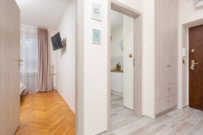 Another hallway view showcasing the apartment's open and bright layout.
