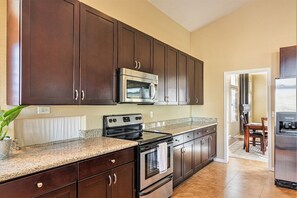 Kitchen with fully equipped cupboards


