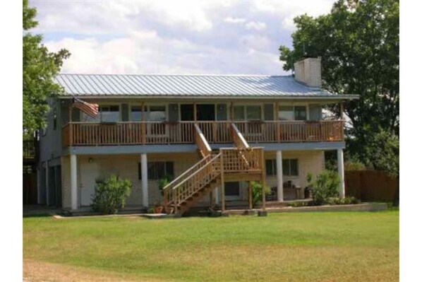 Front view of the house. game room and 1 full bath downstairs.