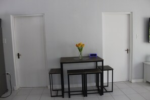 Dining Room & Table with 4 high top chairs .