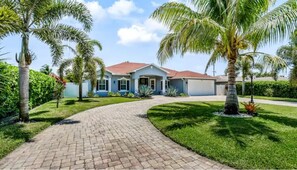 Front of House with Circle Driveway for 6 Cars.