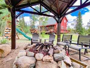 The private gazebo offers a propane fire pit to enjoy, right next to the creek!