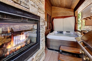 Custom Double Sided Gas Fireplace Next to Hot Tub