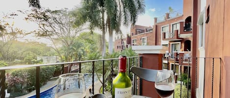 Enjoy a glass of wine or coffee on the terrace while looking out onto the pool