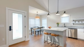 A well-equipped,
full-size kitchen and
dining room is part of
the open concept.