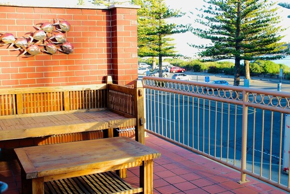 Twin Love Seat for Your Morning Coffee Ritual, or enjoy relaxed alfresco dining with coastal breezes and BBQ vibes.
