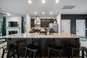 Large Kitchen with everything you could need! Seating at the kitchen island plus dining table.