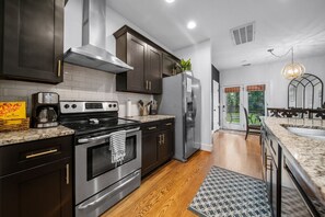 Large Kitchen with everything you could need! Seating at the kitchen island plus dining table.