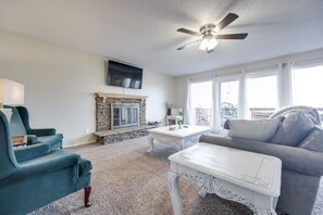 Natural light + access to back deck. Please note fireplace is NOT operational.