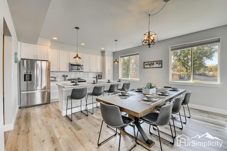 Enjoy the open floor plan with a connected dining, kitchen and living area with ease.