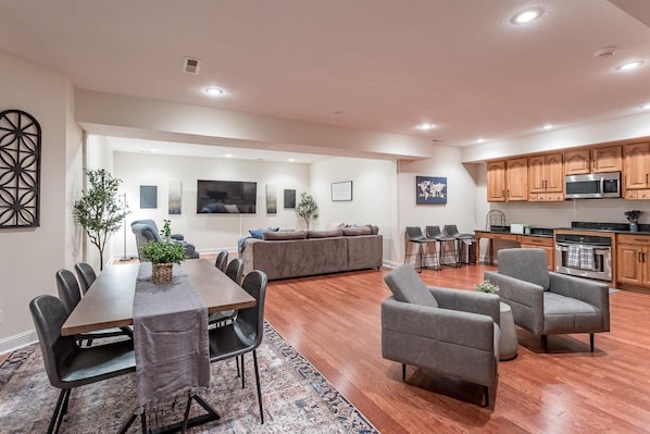 Spacious oversized living, kitchen, and dining space. Abundance of cabinetry and full size kitchen appliances.