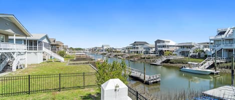 fenced yard on canal with private gazebo