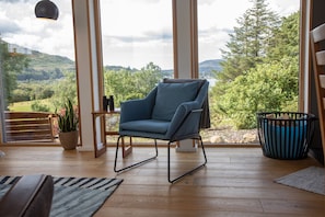 Spectacular views across Loch Portree with floor to ceiling windows.