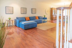 Welcome to the beautiful front room complete with a comfortable sofa and TV