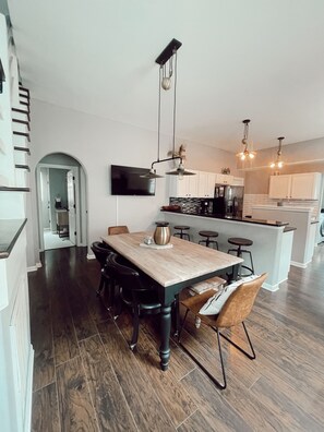 Spacious open-concept kitchen with large dining table 