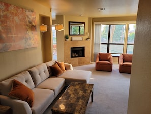 Living room.  Large windows look over the lake.