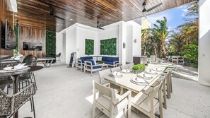 Daytime - Covered Pool Area - 3 HD TVs - Outdoor Dining - BBQ Grill - Ping Pong - and Lounge Area