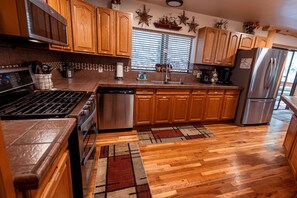 Fully equipped kitchen invites the family to dine in, saving a lot of money!