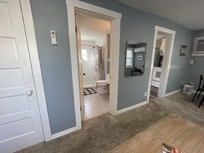 Views into the kitchen and bathroom from the living room 