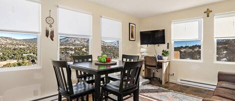 Dining room and living room area with view