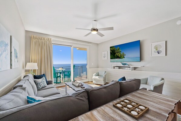 After enjoying the sun, sand and adventure, relax in your beach-inspired living room watching the 75" smart TV.