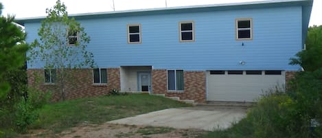 Front of house. The house is not visible from the road. 