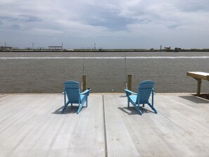 Catch fish from the back patio. Post have rod holders 