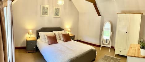 The Master bedroom with exposed roof beams.