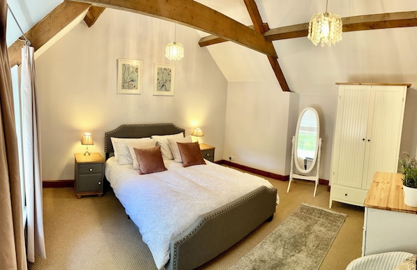 The Master bedroom with exposed roof beams.