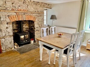 Enjoy a leisurely meal in front of the log fire.