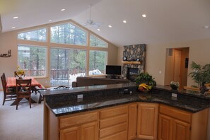 Enjoy cozy fires and meals while looking out at the meadow.
