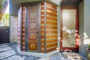 This beautiful copper style door is the entrance to the enclosed outdoor shower.