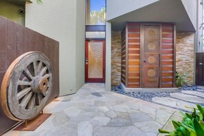Very unique entrance to the front door and enclosed outdoor shower.