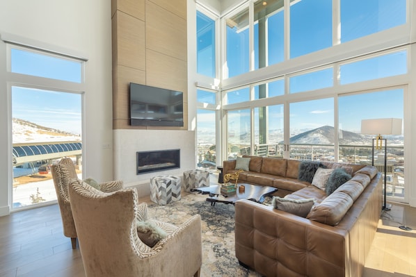 Living room with floor to ceiling windows.