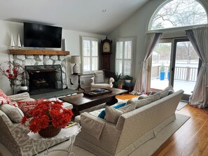 Rear Living Room with Flat Screen TV and Door to Deck