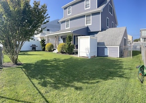 rear fenced yard with shower