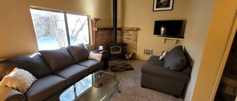 Living room with wood stove, pull out queen sofa
