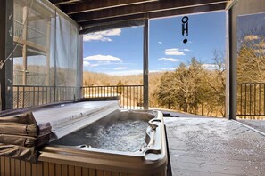 Enjoy the hot tub while looking at the awesome views