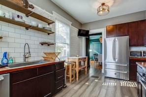 Gourmet Kitchen with Imported italian appliances. Open to large dining, game, and bourbon tasting room.