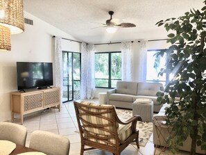 Living room has internet ready television and opens to the lanai