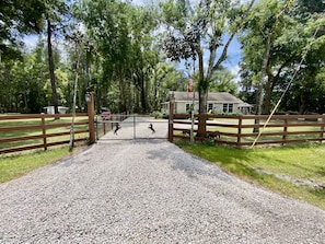 Private, gated guest entrance with motorized gate. 