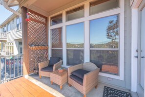 Upper level deck with covered seating area.