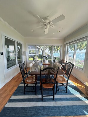Large dining table with amazing views of the water! 