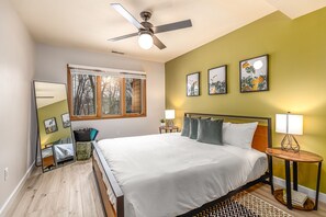Bedroom 2 with views of the wooded backyard